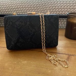 Black faux snakeskin clutch